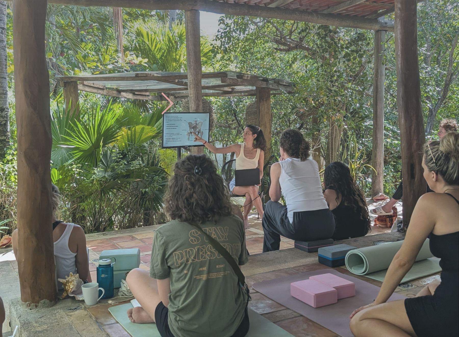Stephania teaching an outdoor anatomy session to a group of students